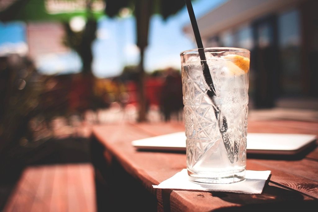 A cocktail being finished at the bar